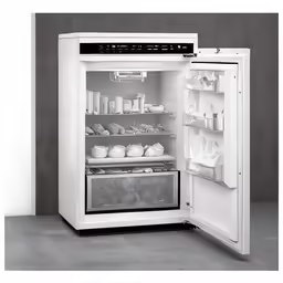 there is a white fridge with food on it
