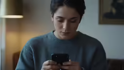 a woman with a phone in her hands
