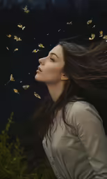 woman with flying butterflies in the air