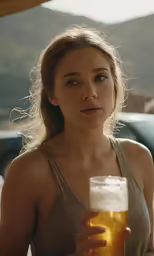 woman in tank top looking concerned while holding beer