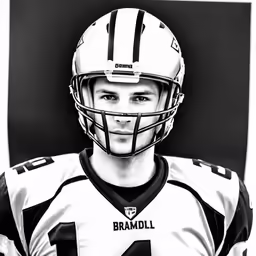 a black and white image of a football player