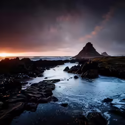 an ocean shore with a large body of water