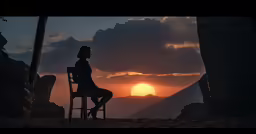 a woman in a chair standing and looking at a sun setting