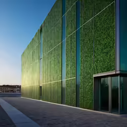 a building that has a green wall next to it