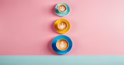 three plates with coffee cups are shown in three different colors