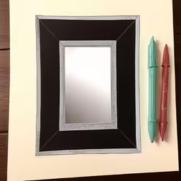 a pen and mirror that is on a table