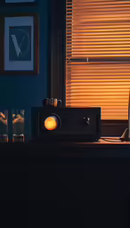 a vintage radio sitting on a table with glasses on it