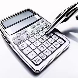 a pen and a calculator on a white table