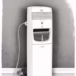 a desktop computer sitting in the corner of a room