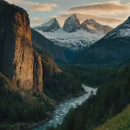 a mountain area with water, rocks and trees
