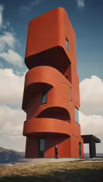 a tall orange building sitting in the middle of a field
