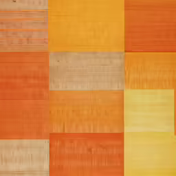 an orange and yellow colored rug with different squares