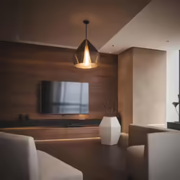 a living room with a flat screen television on the wall