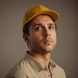 an extremely young man with a nice hat
