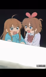 two cute girls sitting next to each other