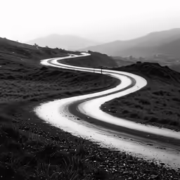 black and white photo of a winding mountain road