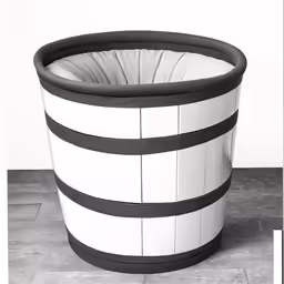 a large potted planter with black and white stripes