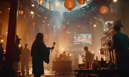 a person on a cell phone in a room filled with people