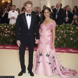 a young couple standing together in a formal dress,prince harry and princess harry on the red carpet