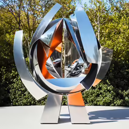 an interesting sculpture with a unique design around it