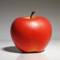 an apple is shown with water droplets on it