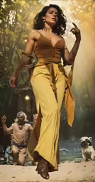 the woman wearing a yellow dress has her hand up