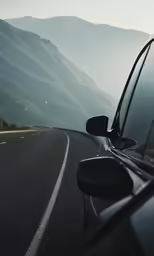 the road is empty with a car stopped at the side