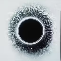 an opening in the ice that appears to be a circular object