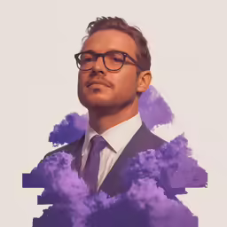 a man with glasses wearing a suit and tie