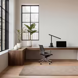 the minimalist home office features natural wood and glass accents