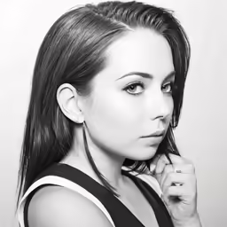 a young woman posing with her head down