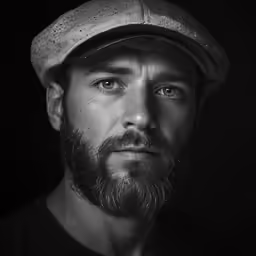 a man with a beard and a hat