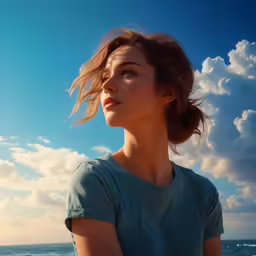 a girl looks off to the distance, as she stands in front of the water