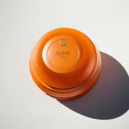 a bright orange object on a white background