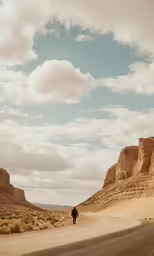 a lone man stands at the end of the road