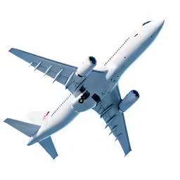 a plane flying in the sky with its landing gear down