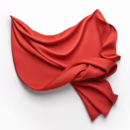 an orange, knotted piece of fabric on a white surface