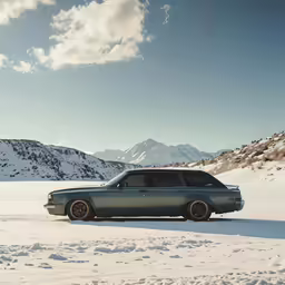 the gray car sits in the snow covered mountains