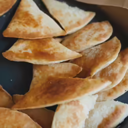 small triangles on a tray in a plastic container