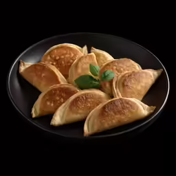 some pancakes with a leaf in it are arranged on a plate
