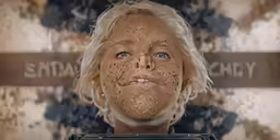 a picture of an old blond woman that is very scary