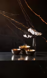 a wooden bowl with some white cloths on top
