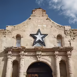 a big star sitting on the side of a building