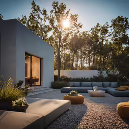an outdoor living area with couches and tables in the sun