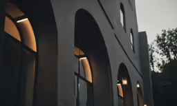 an empty building is lit by a pair of lights