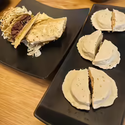 there is two plates with desert items on them