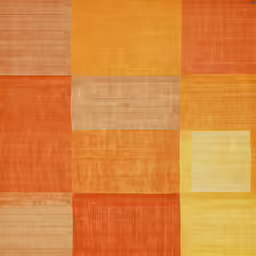 a very beautiful color block style rug in orange and gold