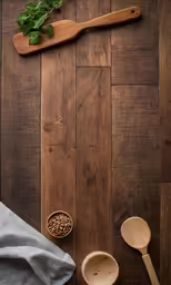 a wooden cutting board with herbs on top and measuring spoons nearby