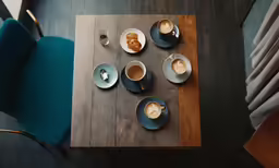 a table set with coffee, milk and tea