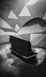 the bench sits in front of a mural of curved hills